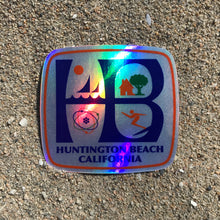 Load image into Gallery viewer, HB Huntington Beach, California, classic HB City logo metallic hologram, high quality, vinyl sticker. Great for outdoor or indoor use! This classic HB logo has the sail boats and sun in the upper left corner representing Huntington Harbour sailing, the house and tree in the upper right corner representing family life, the atom in the bottom left corner representing the ingenuity of our aerospace industry and a surfer in the lower right corner representing our surf culture here in Huntington Beach.