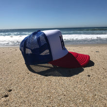 Load image into Gallery viewer, HB Foam Snapback Red/White/Blue Trucker Hat - Embroidered Full Color HB City Logo - HB Partial Puff Stitching - Huntington Beach California Pro Style, 5 Panel, Mid Profile, 100% Polyester Foam Front - 100% Nylon Mesh Back - Plastic Adjustable Snap Back - One Size Fits Most - $27.95.