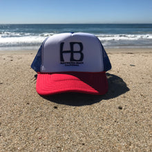 Load image into Gallery viewer, HB Foam Snapback Red/White/Blue Trucker Hat - Embroidered Full Color HB City Logo - HB Puff Blue Stitching - Huntington Beach California Pro Style, 5 Panel, Mid Profile, 100% Polyester Foam Front - 100% Nylon Mesh Back - Plastic Adjustable Snap Back - One Size Fits Most - $25.95.