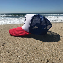 Load image into Gallery viewer, HB Foam Snapback Red/White/Blue Trucker Hat - Embroidered Full Color HB City Logo - HB Puff Blue Stitching - Huntington Beach California Pro Style, 5 Panel, Mid Profile, 100% Polyester Foam Front - 100% Nylon Mesh Back - Plastic Adjustable Snap Back - One Size Fits Most - $25.95.